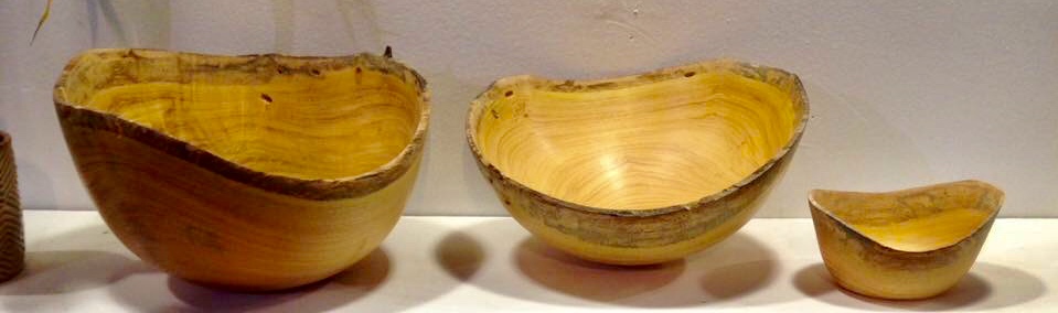 Set of yellow wood natural edge bowls