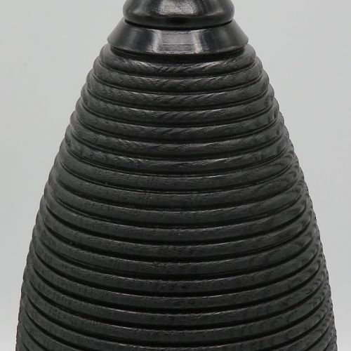 Ebonised ,beaded and texturned tall hollow form.