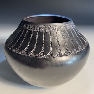 Black-on-black with feather pattern Hollow Form.