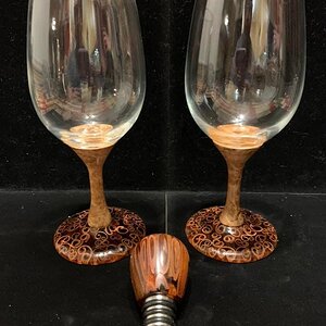 Wine glass stems and a bottle stopper