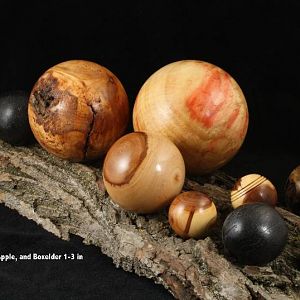 Bevy of bodacious balls brazenly balanced on a burly butternut bark board
