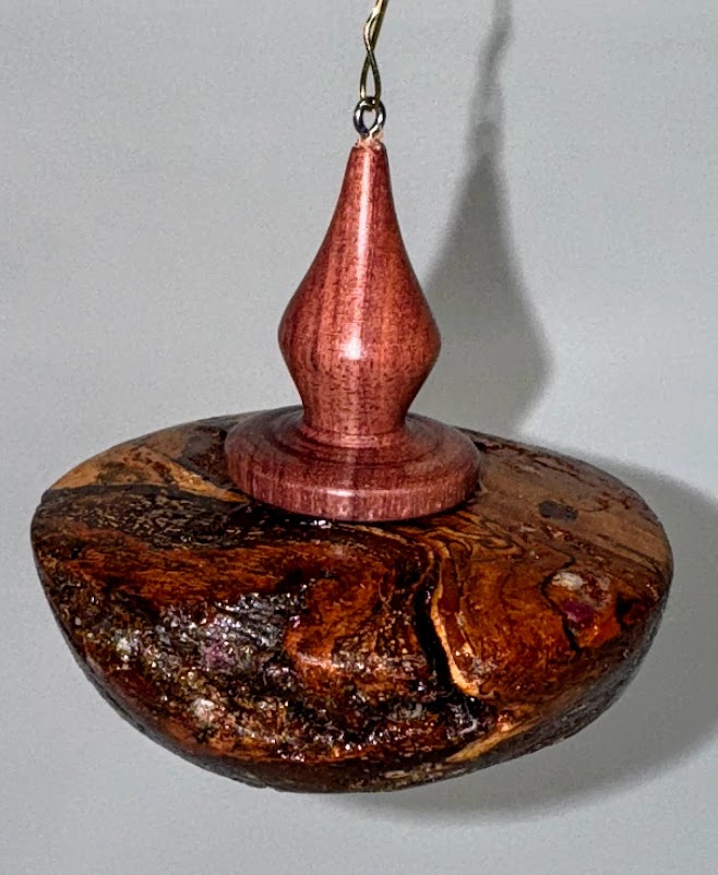 Cherry burl and royal ebony finial.