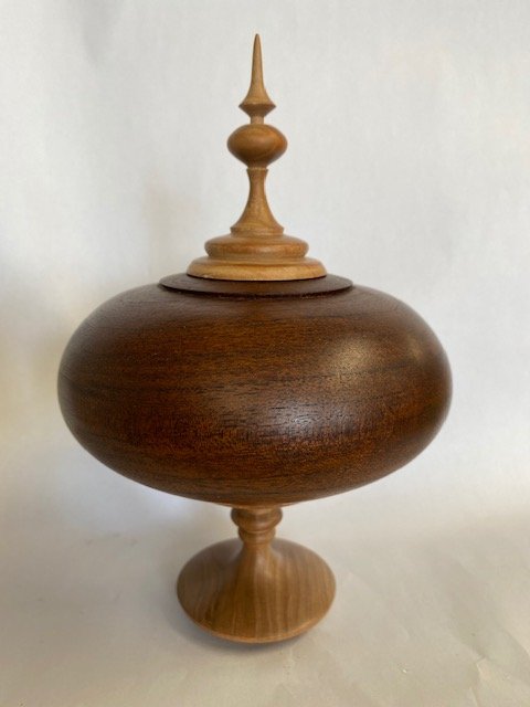 Mesquite hollow form with cherry finial and base.