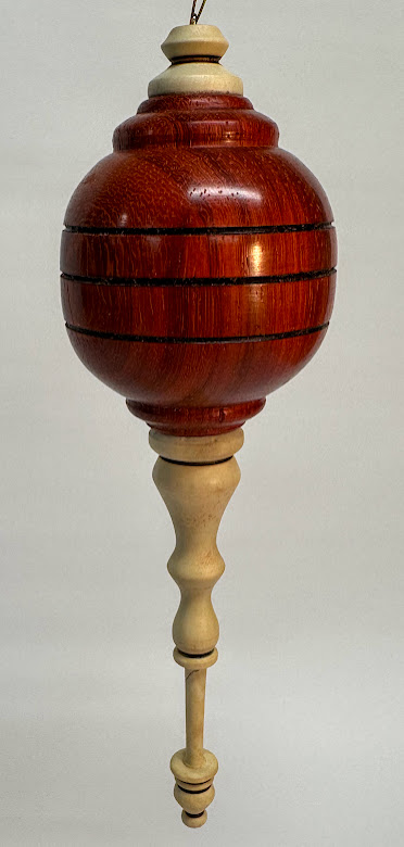 Padauk hollow form with holly finials